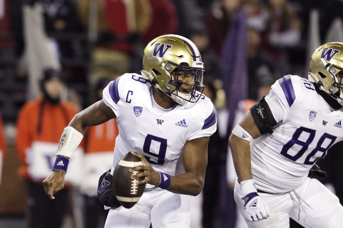 Washington quarterback Michael Penix Jr. looks for a receiver against Washington State.