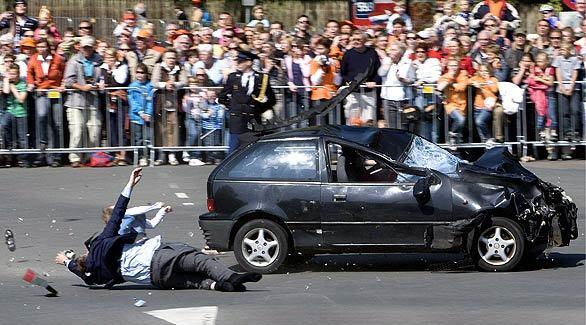 Two bystanders are knocked to the ground by a vehicle driven at full speed through a crowd of spectators gathered for a visit of Queen Beatrix of the Netherlands in Apeldoorn. The crash happened as crowds were gathered for Queen's Day, a national holiday in Holland.