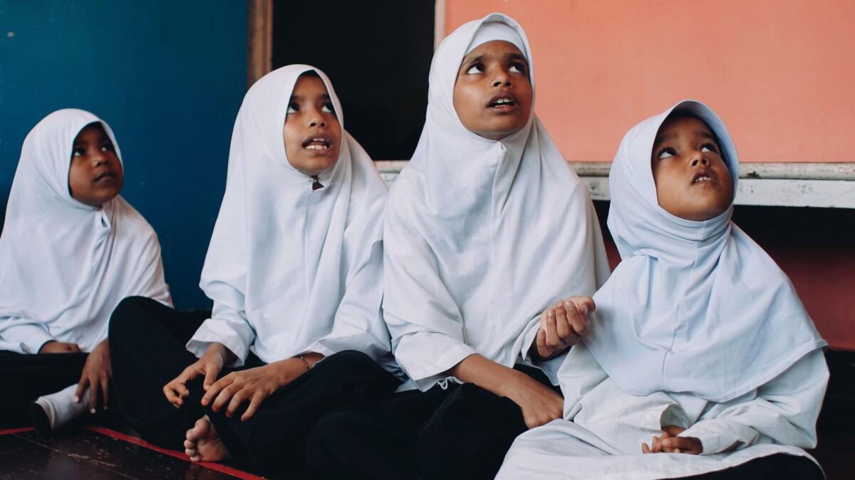 in Penang, Malaysia, Rohingya girls attend a community school run by a local nongovernmental organization that has condemned human rights abuses against the ethnic Muslim minority.