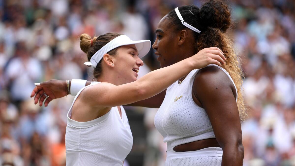 Simona Halep and Serena Williams embrace after Halep won the Wimbledon women's final in straight sets Saturday.