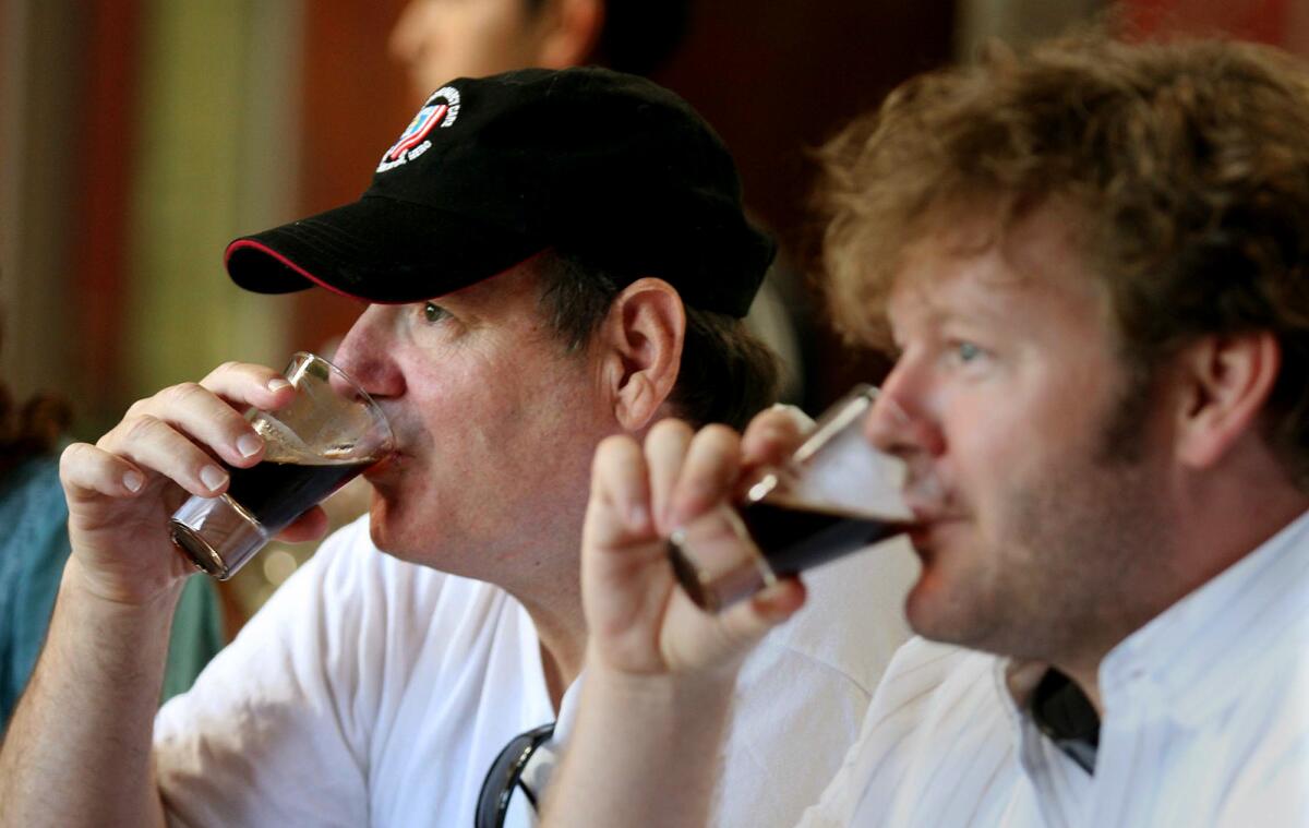 A file photo shows some stout being tasted at Stone Brewing Co. in San Diego.