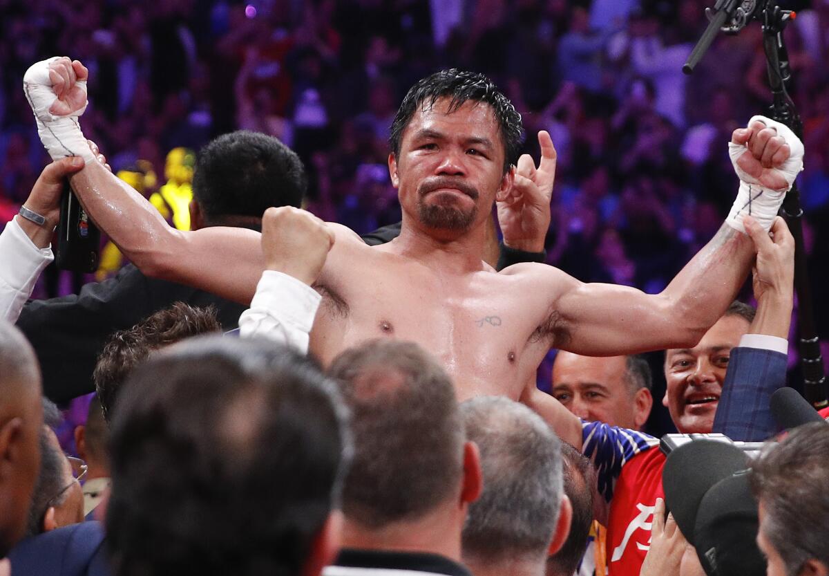 Manny Pacquiao reacts after defeating Keith Thurman.