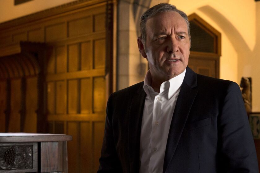 This image released by Netflix shows Kevin Spacey in a scene from "House Of Cards." Netflix says it's suspending production on "House of Cards" following harassment allegations against Spacey. (David Giesbrecht/Netflix via AP)