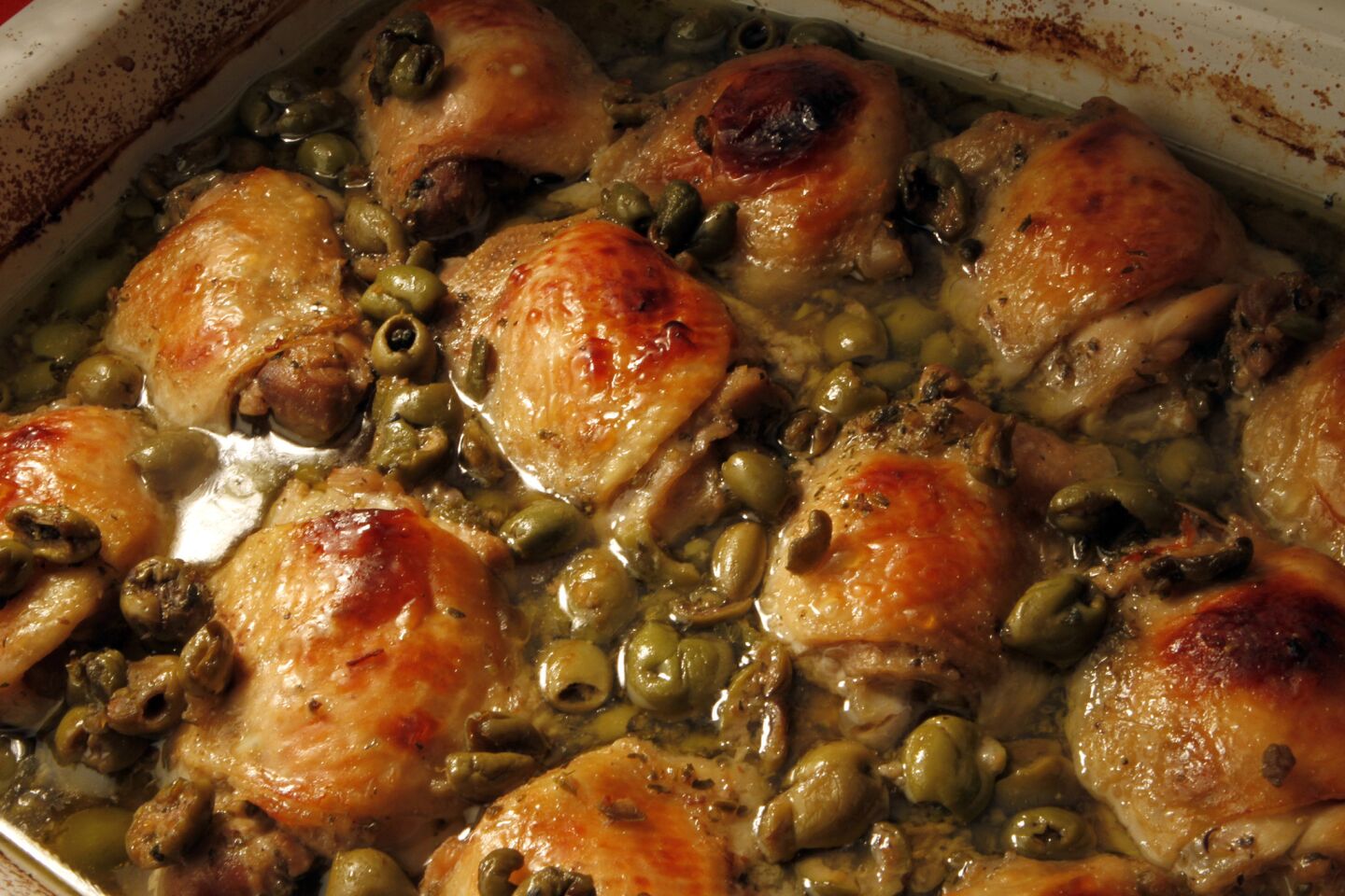 Chicken thighs with honey, olives and oregano