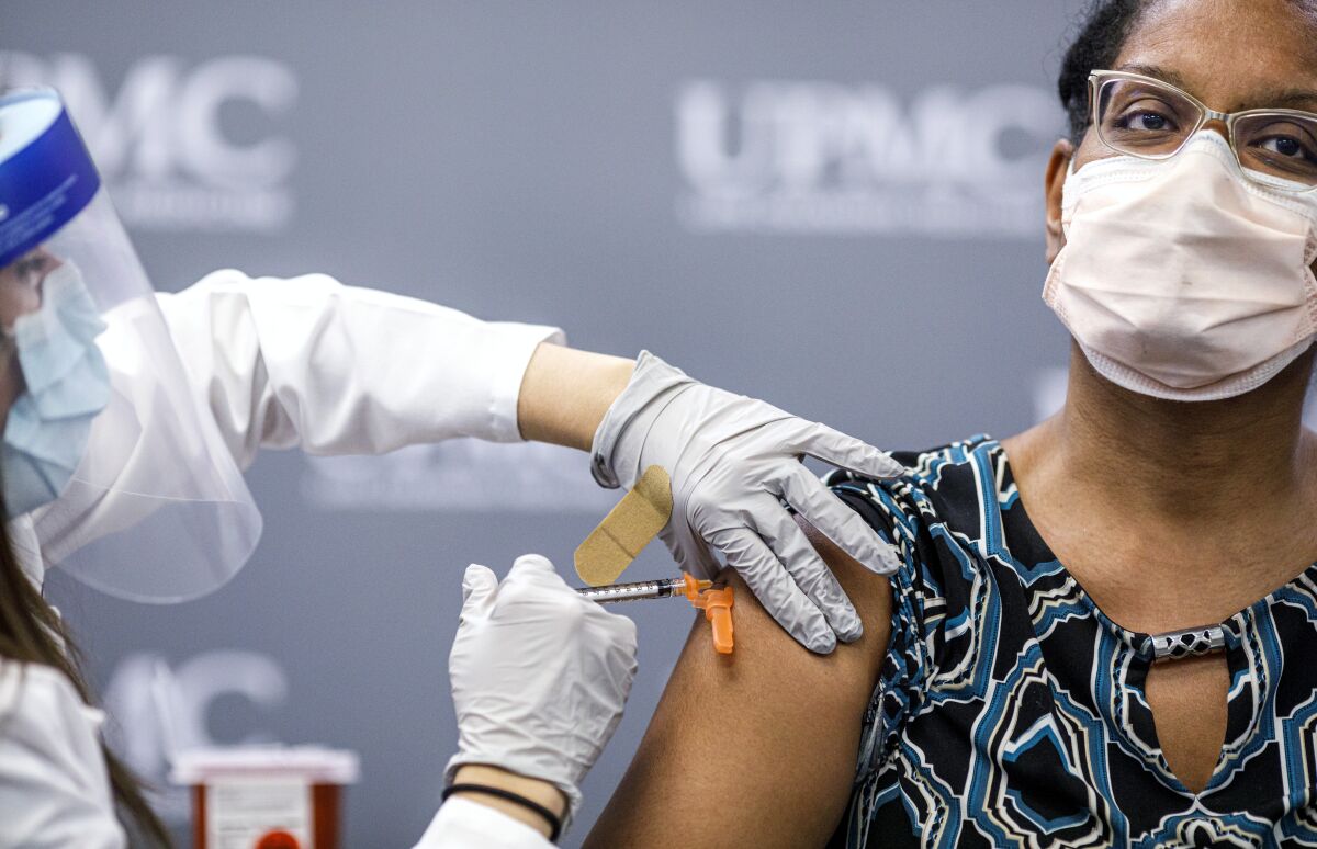 Sharee Livingston, a doctor at University of Pittsburgh Medical Center in Lititz, Pa., receives COVID-19 vaccine Dec. 18. 