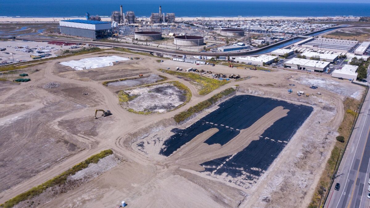 An aerial image taken May 28 shows the former 38-acre Ascon Landfill property at the southwest corner of Hamilton Avenue and Magnolia Street in Huntington Beach. Nearby residents are complaining about dust from an ongoing cleanup at the site.