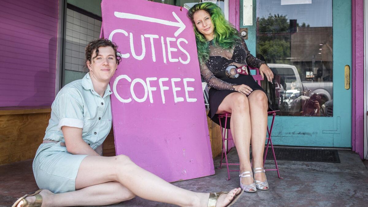 Cuties Coffee co-owners Virginia Bauman, left, and Iris Bainum-Houle, right, founded the shop a year ago as an LGBTQ community space.