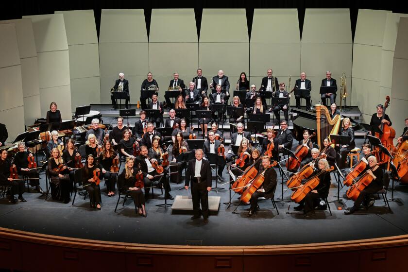 The Poway Symphony Orchestra, with conductor John LoPiccolo center.