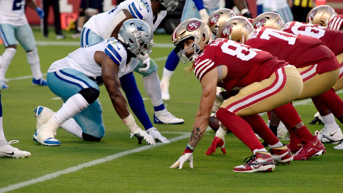 Football players get into position