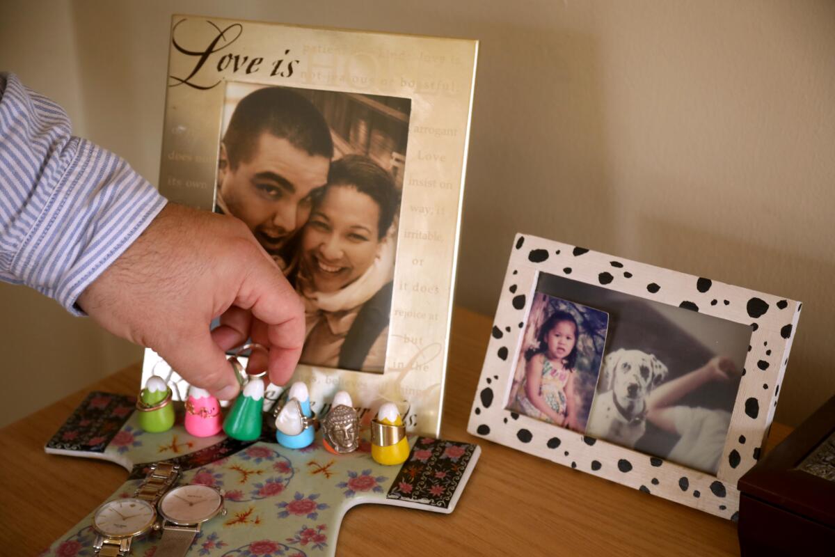 A Wink and Wonder ring holder next to a portrait of Abraham and his wife Cecilia Beltran