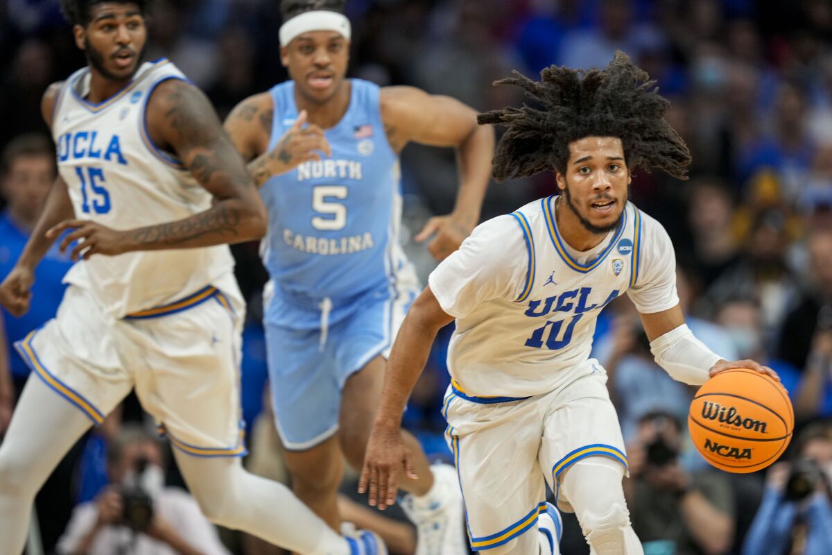 UCLA guard Tyger Campbell controls the ball against North Carolina.