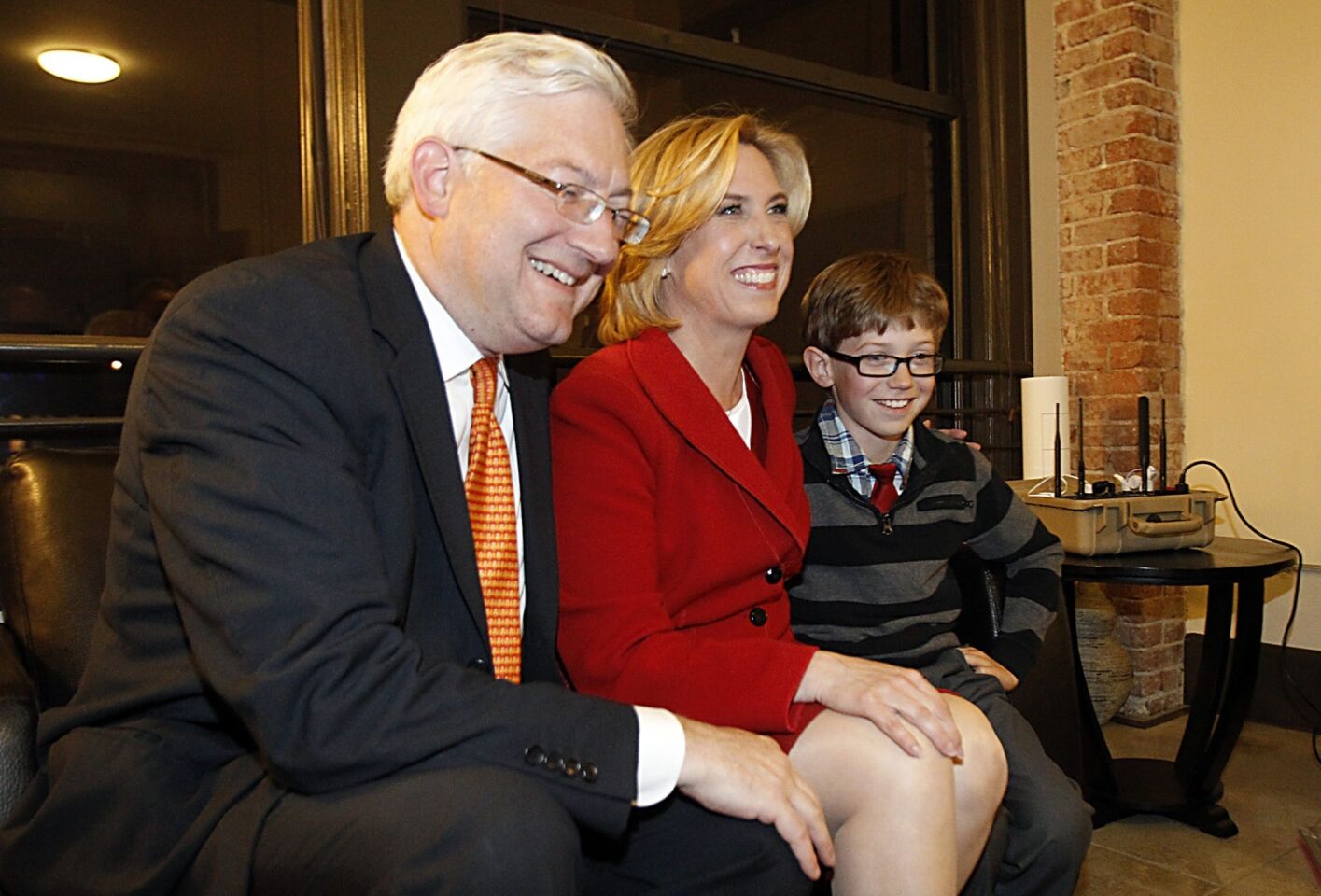 Wendy Greuel is joined by her husband, Dean Schrammm, and her son, Thomas, as they check election results in downtown Los Angeles.