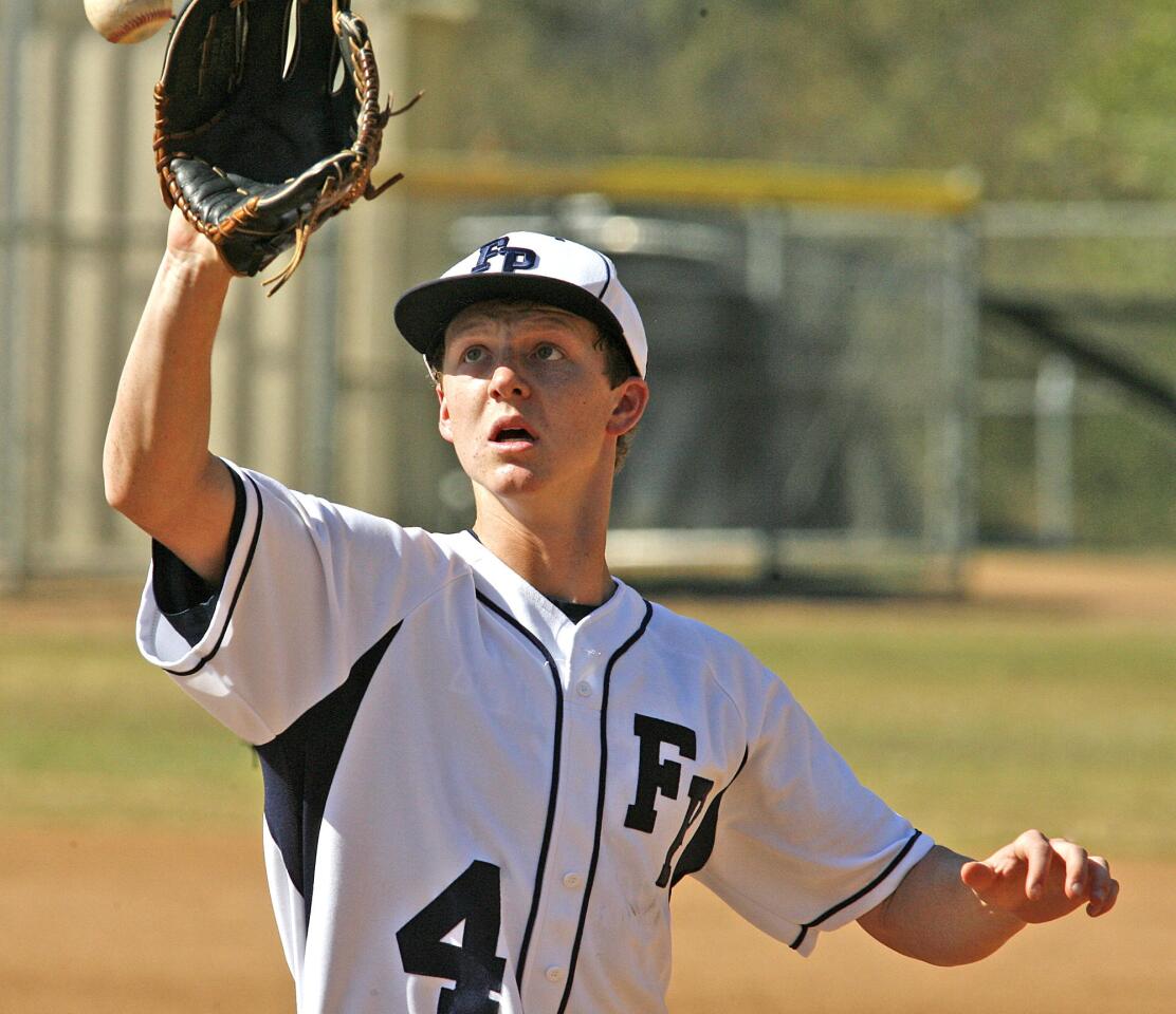 Flintridge Prep's pitcher runs to make a play and toss the ball to first base to get the out against Chadwick in the third inning in a Prep League baseball game at the Glendale Sports Complex on Friday, April 26, 2013.