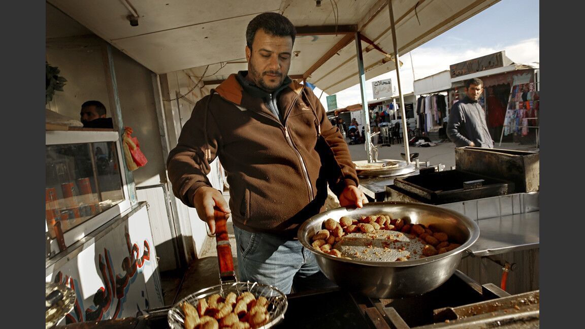 Saleh Jibraail runs a falafel stand in the Zaatari refugee camp. He ran a falafel shop in Damascus until it was destroyed in the fighting. “I realized there was a demand here, so I decided to do what I knew to do best: falafel,” he says.