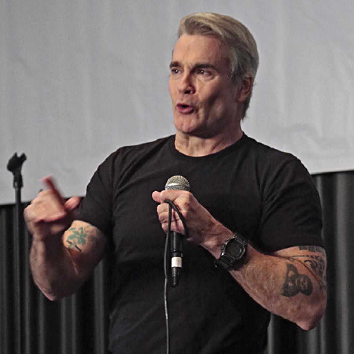 "When you get out into the world you meet people whose humanity eclipses your own," Henry Rollins told L.A. Times Travel Show visitors on Sunday. "And hopefully you can bring it back to your normal 9-to-5 day and come back different than you've been before."