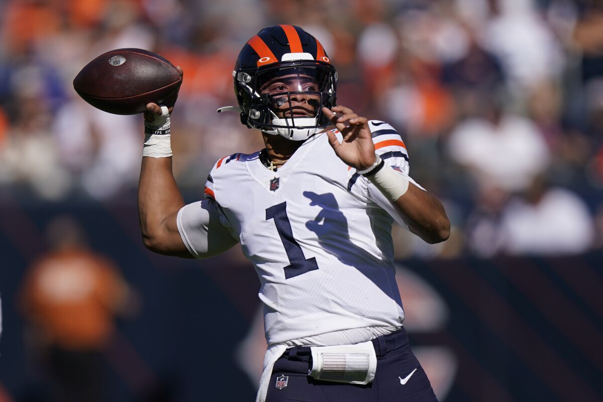Chicago Bears quarterback Justin Fields passes during the first half of an NFL football game against the Green Bay Packers Sunday, Oct. 17, 2021, in Chicago. (AP Photo/Nam Y. Huh)