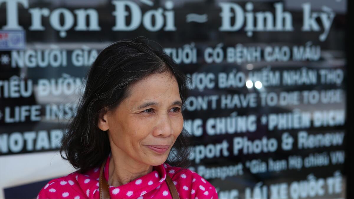 Huong Pham, seen May 18, 2016, in Little Saigon in Westminster, talks about President Obama's landmark visit to Vietnam.