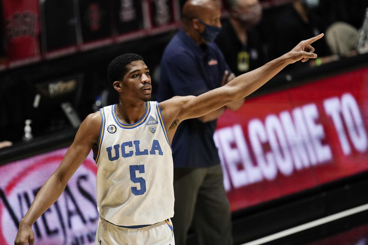 UCLA guard Chris Smith points to a teammate.