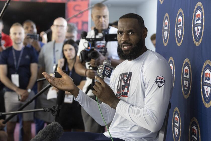 LeBron James of the Los Angeles Lakers responds to a question from a reporter during training camp for the United States men's basketball team Saturday, July 6, 2024, in Las Vegas. (AP Photo/Steve Marcus)