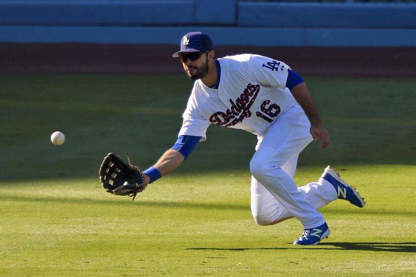 Dodgers center fielder Andre Ethier makes a catch on a ball hit by the Mets' Ruben Tejada.