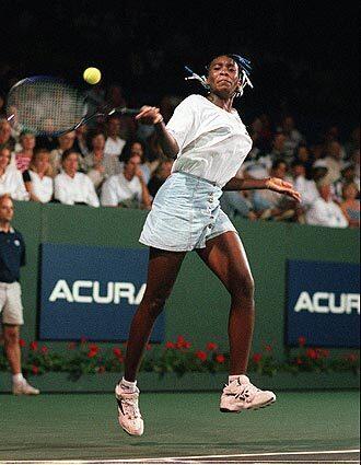 Venus Williams returns a shot to Steffi Graf in the Acura Classic Tennis tournament in Manhattan Beach in 1996.