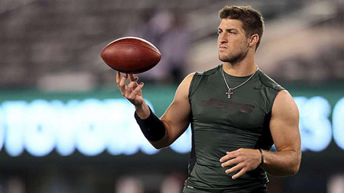 Tim Tebow warms up with the New Jersey Jets in 2012 at MetLife Stadium in East Rutherford, N.J.