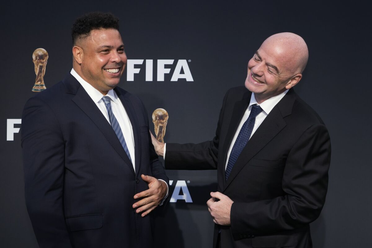 FIFA President Gianni Infantino, right,
