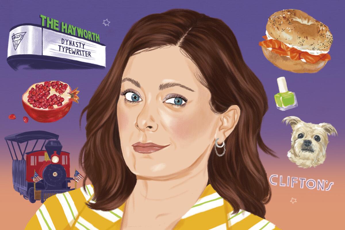 Portrait of Rachel Bloom with Dynasty Typewriter marquee, pomegranate, train, lox bagel, nail polish, dog and Clifton's logo