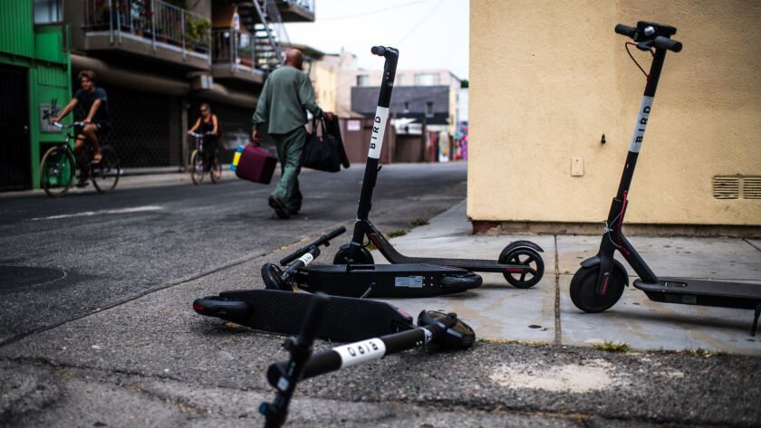 Bird electric scooters in an alleyway near the Venice Beach Boardwalk. Over the weekend, the company was asked to remove its scooters from the Balboa Peninsula.