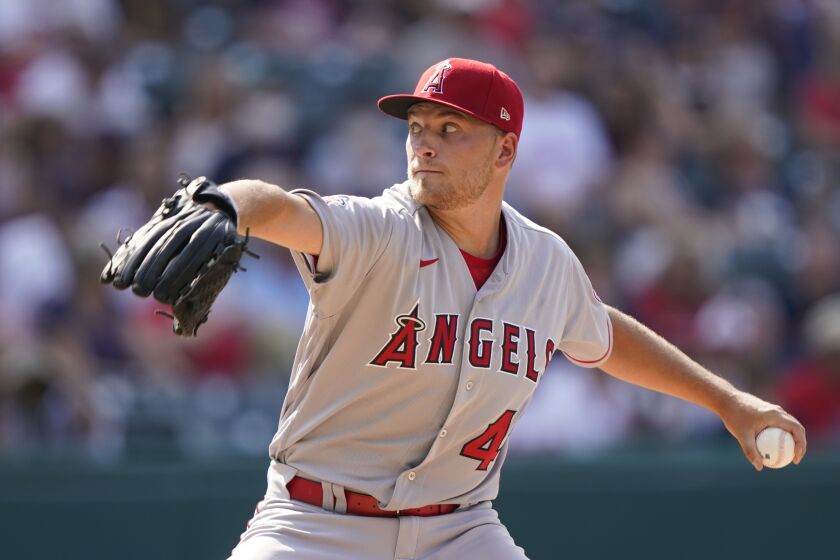 Los Angeles Angels starting pitcher Reid Detmers delivers in the first inning of a baseball game against the Cleveland Indians, Saturday, Aug. 21, 2021, in Cleveland. (AP Photo/Tony Dejak)