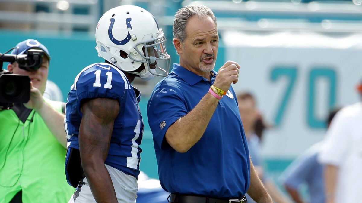 Colts Coach Chuck Pagano speaks with wide receiver Quan Bray before a game against the Dolphins in Miami on Dec. 27