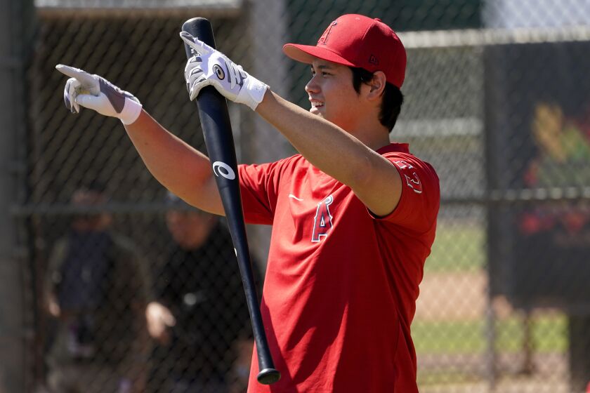 Los Angeles Angels' Shohei Ohtani waits to hit during the teams' spring training baseball workouts, Monday, March 14, 2022, in Tempe, Ariz. (AP Photo/Matt York)