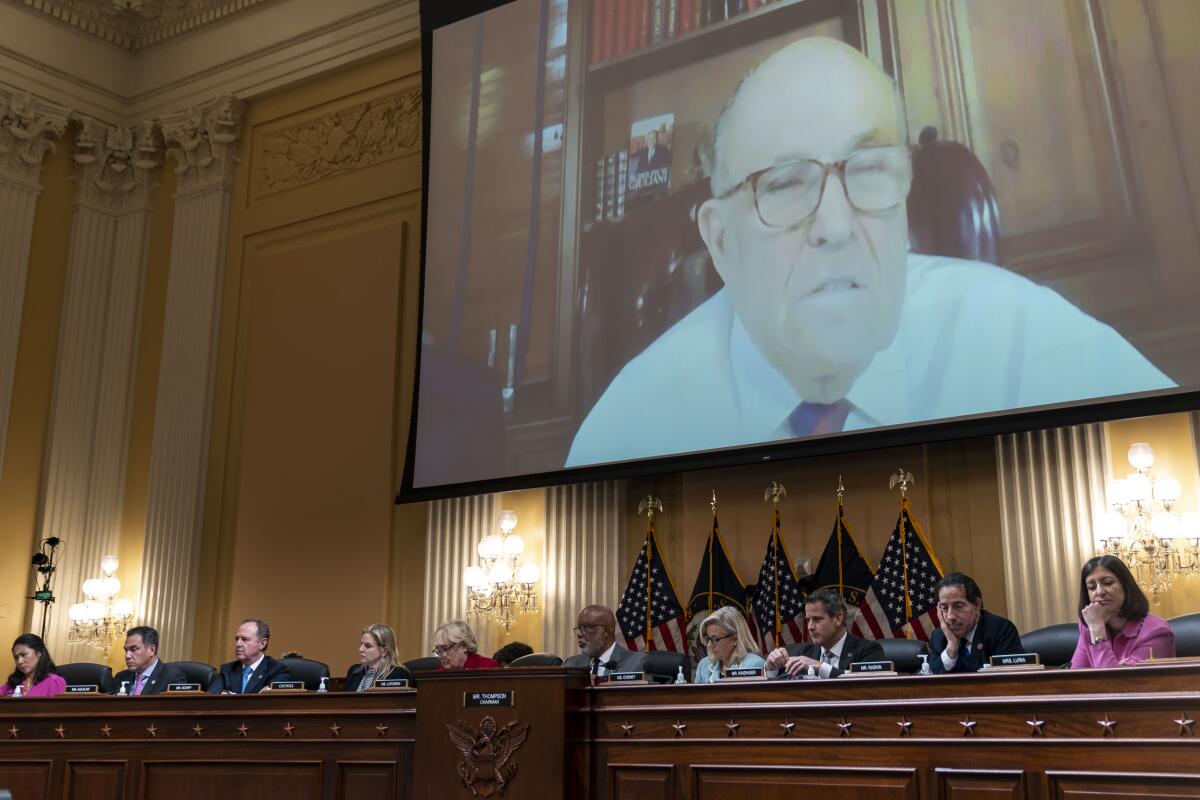 Rudolph W. Giuliani appears on a giant screen