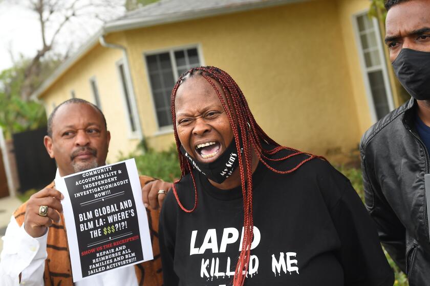 LOS ANGEL;ES, CALIFORNIA APRIL 13, 2021-Lisa Simpson, whose son was killed by LAPD officers, speaks outside a home owned by Patrisse Cullors, a co-founder of BLM in Los Angeles Tuesday. Cullors has purchased fourhigh-end homes worth $3.2 million according to property records. (Wally Skalij/Los Angeles Times)