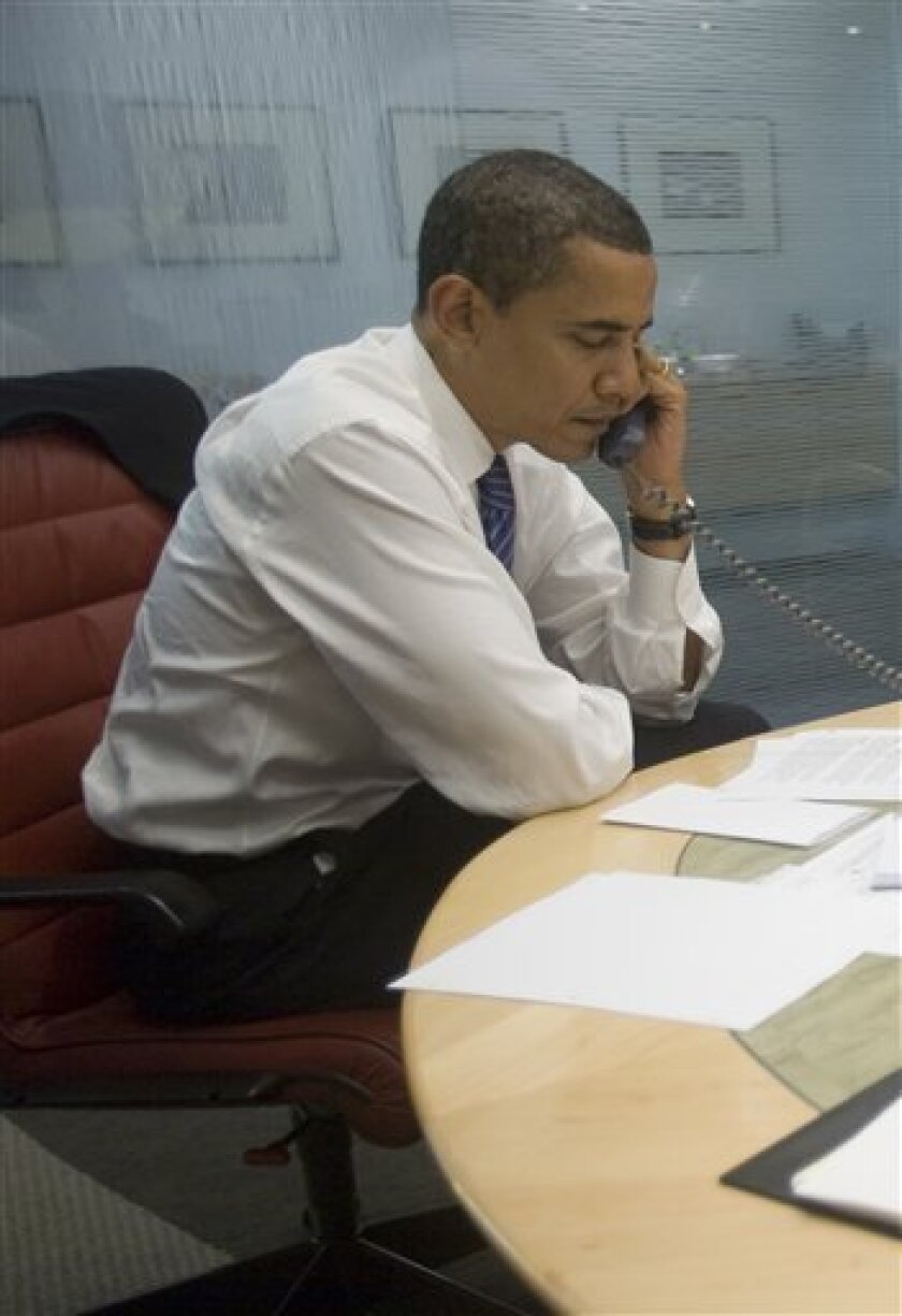 In this photo released by President-elect Obama's staff, President-elect Obama talks on the telephone with Israeli Prime Minister Ehud Olmert in Chicago Thursday, Nov. 6, 2008. ((AP Photo/Obama for America, David Katz)