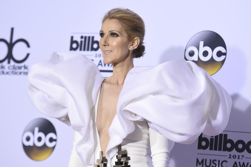 Celine Dion poses in white billowing gown at the 2017 Billboard Music Awards at the T-Mobile Arena in Las Vegas