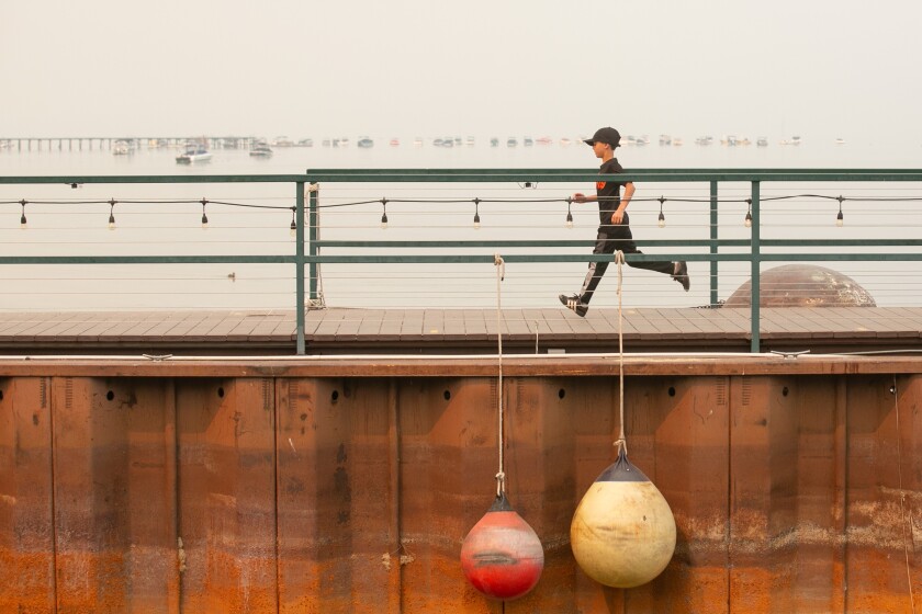A child runs on the dock 
