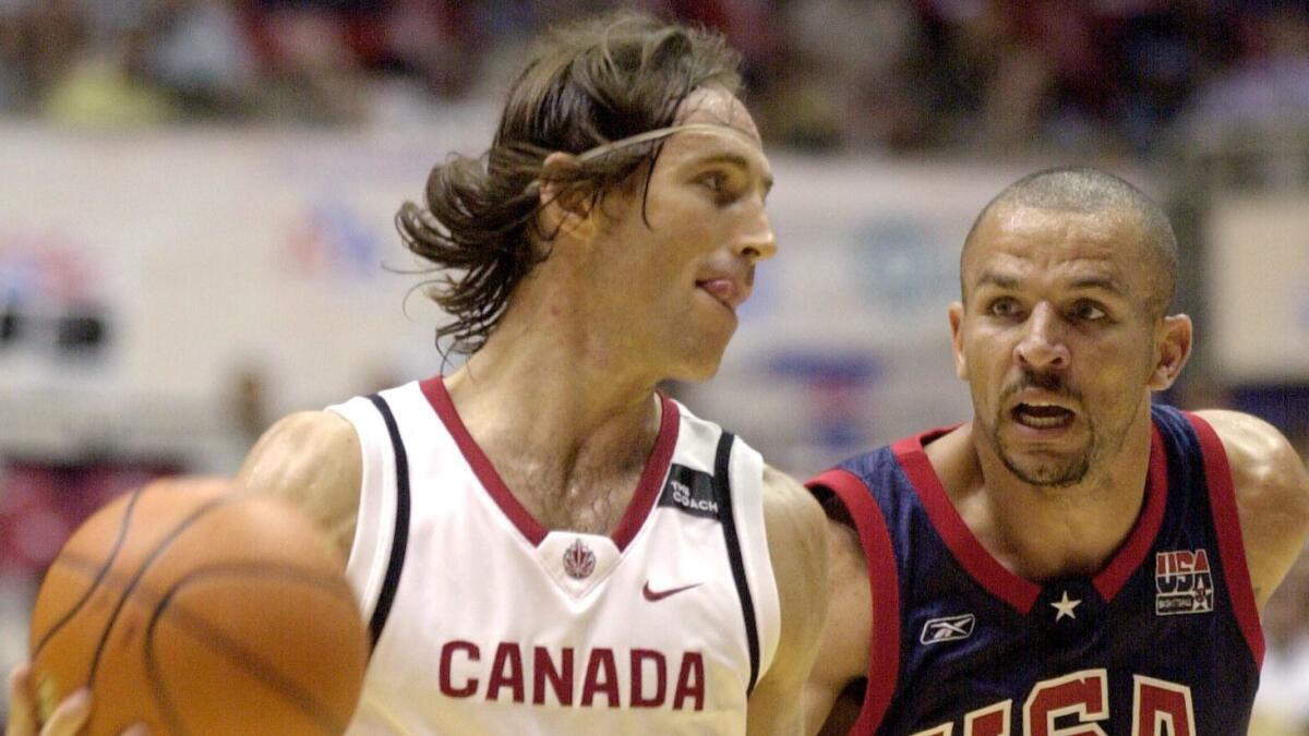 Steve Nash is guarded by Jason Kidd during the FIBA Americas Olympic Qualifying Tournament at the Roberto Clemente Coliseum in San Juan, Puerto Rico in 2003.