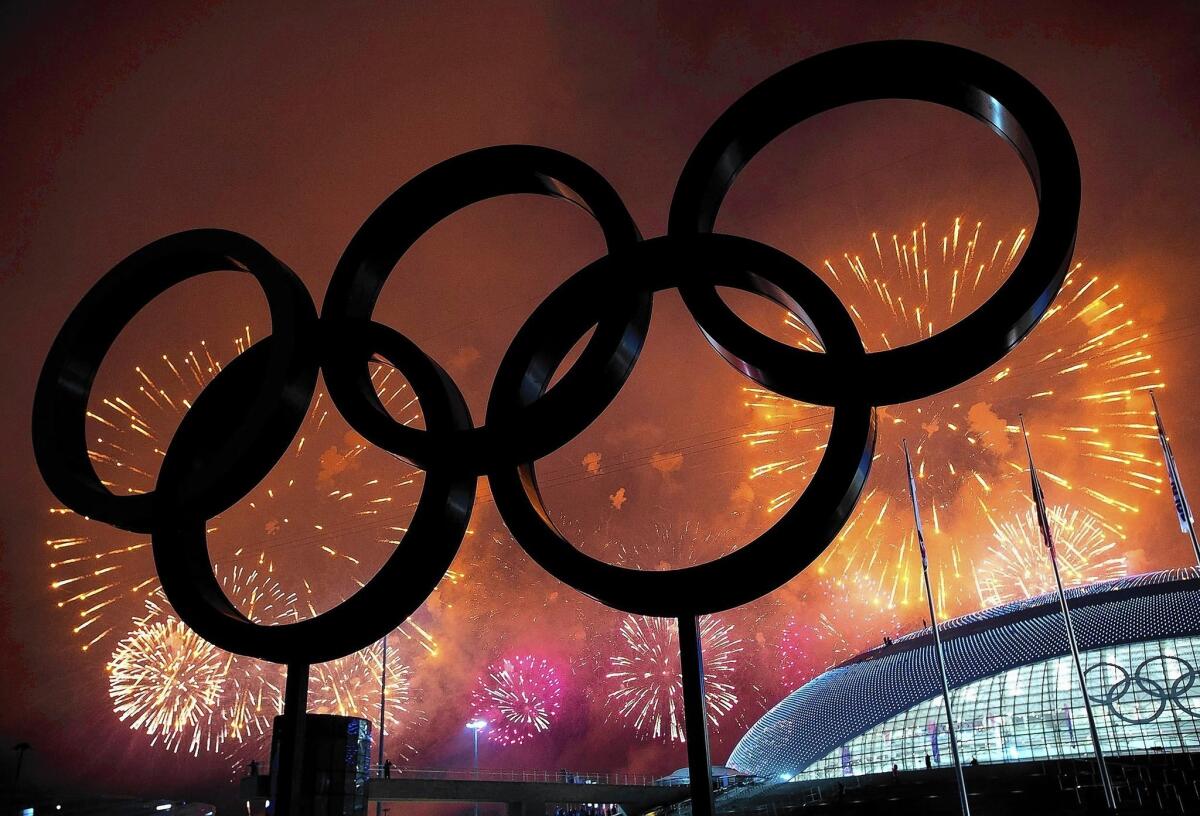 The Olympic Rings are silhouetted as fireworks light up the sky during the closing ceremonies at the 2014 Winter Olympics in Sochi, Russia. NBCUniversal’s coverage of the Games brought in $1.1 billion in revenue.