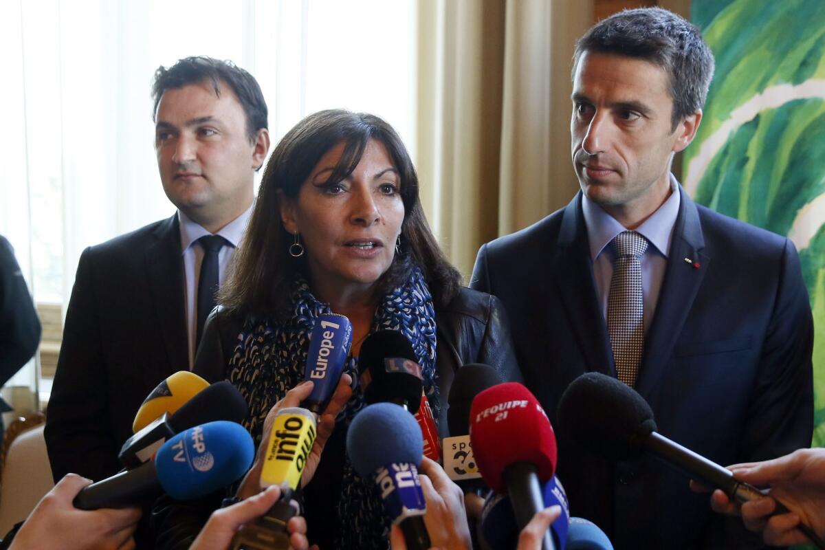 Paris Mayor Anne Hidalgo addresses journalists on April 13 following a city council vote to support a bid for 2024 Summer Olympics.