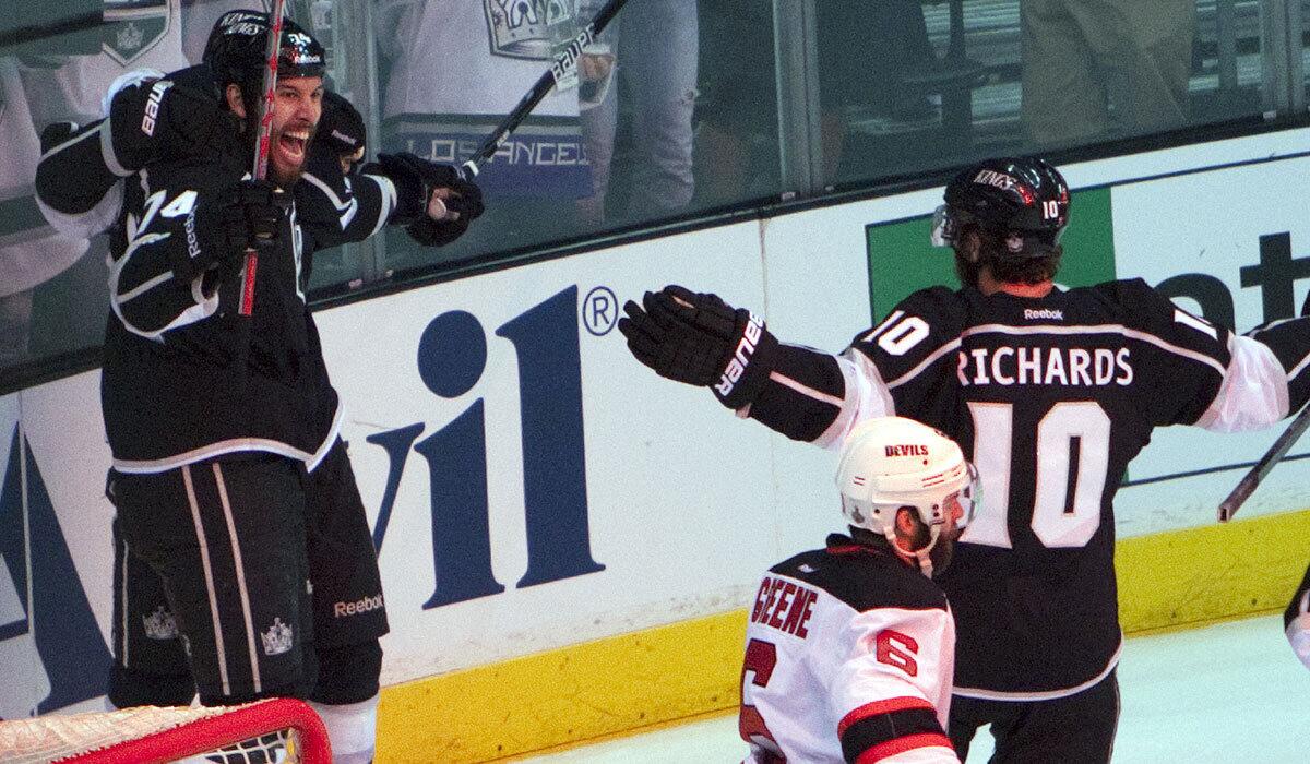 Justin Williams, left, and Mike Richards celebrate a Kings goal against New Jersey in Game 6 of the 2012 Stanley Cup Finals. Both are now with the Washington Capitals.
