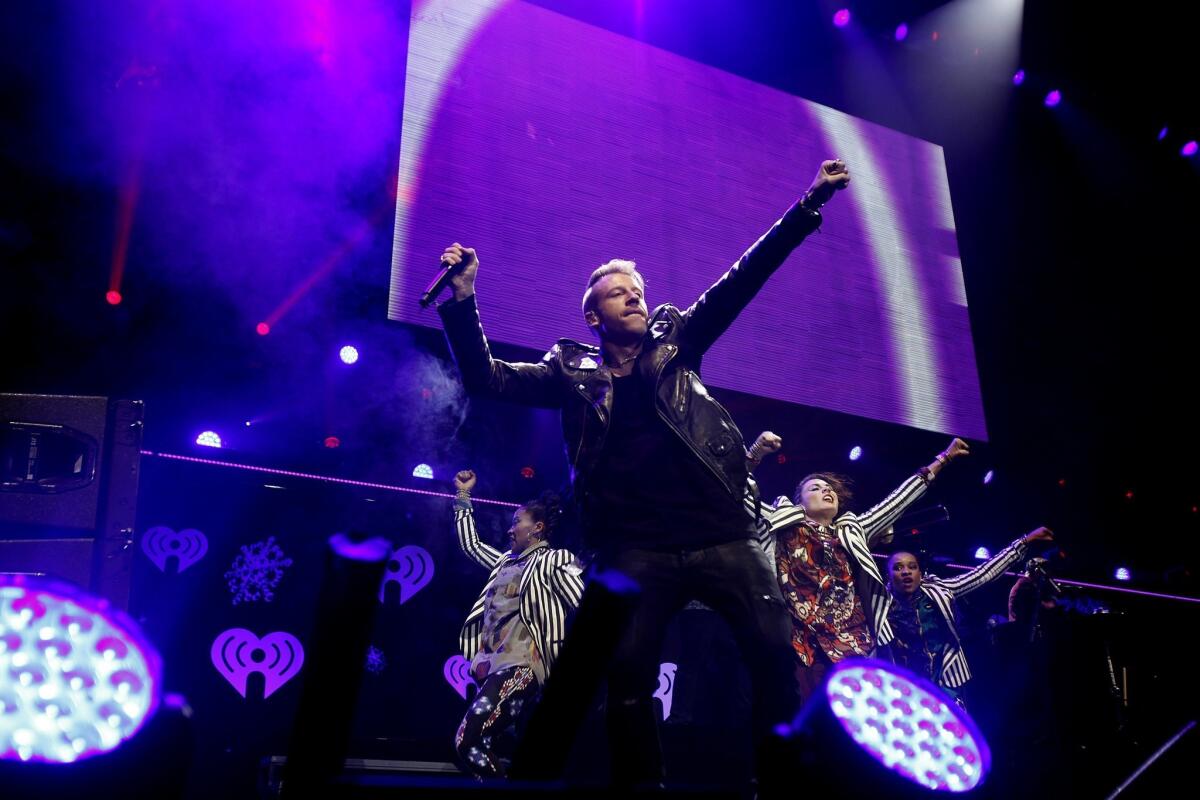 Macklemore (foreground) & Ryan Lewis won the rap album Grammy, among others.