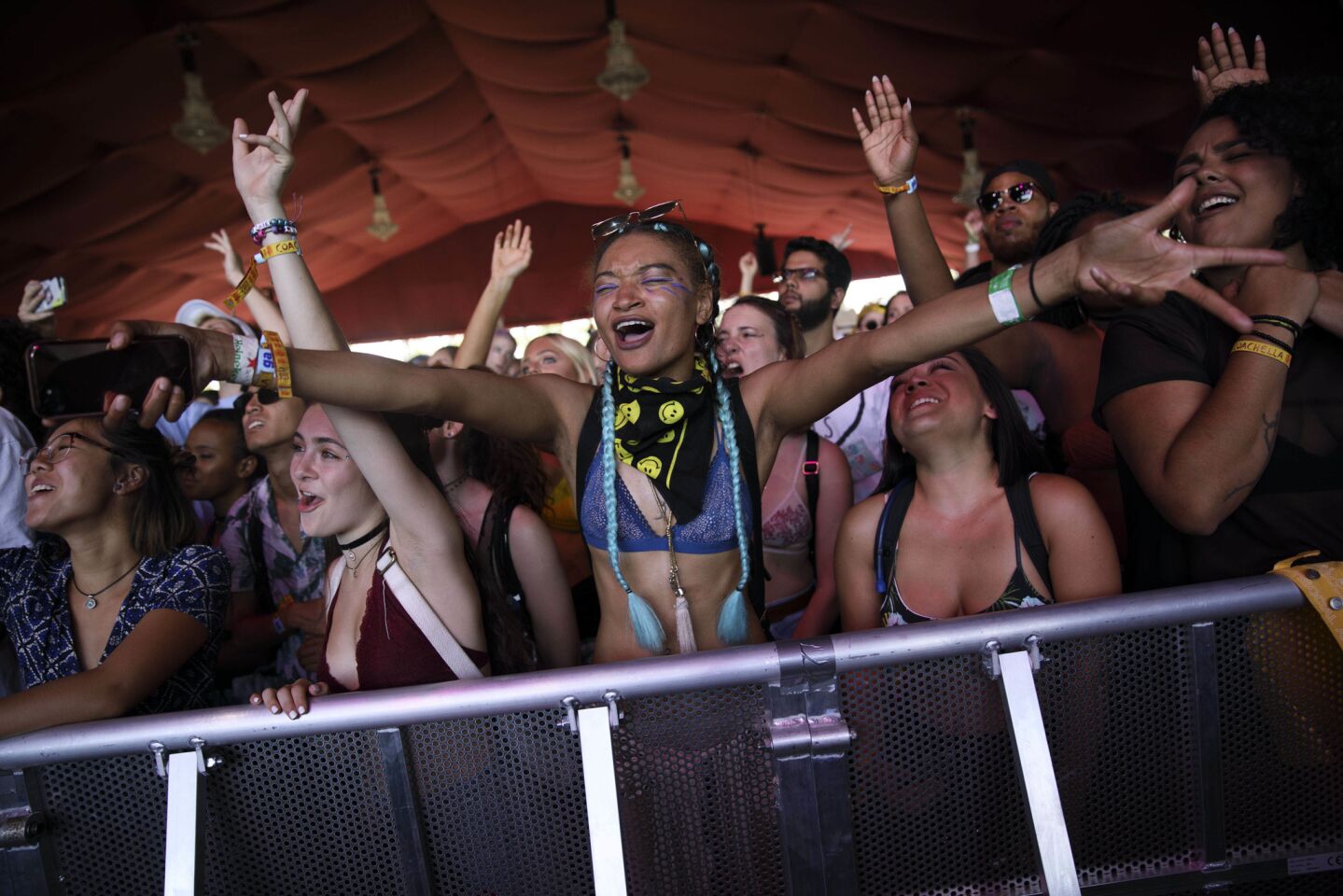 Kiara Price, center, raises her arms in the crowd as British singer-songwriter Neo Jessica Joshua, known as NAO, performs during weekend one of the three-day Coachella Valley Music and Arts Festival at the Empire Polo Grounds on Sunday, April 16, 2017 in Indio, Calif. (Patrick T. Fallon/ For The Los Angeles Times)