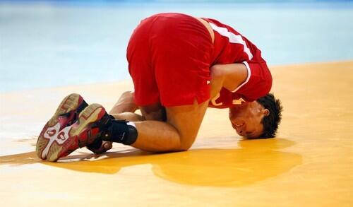 Denmark's Hans Ottar Lindberg lays down injured during the men's handball preliminary group B match Germany vs. Denmark on August 18, 2008 in Beijing, as part of the 2008 Beijing Olympic Games.