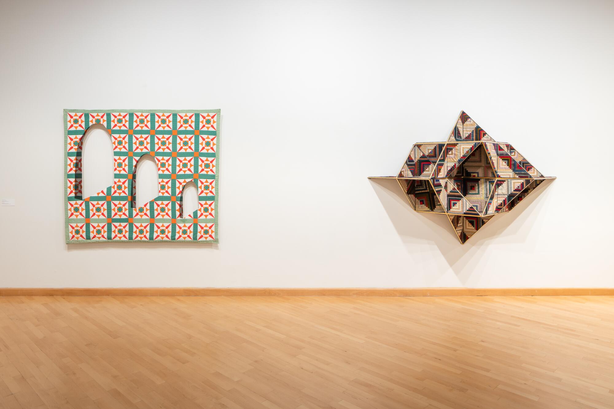 A gallery shows works made with quilts: one features a series of arched cutouts, the other looks like a space ship