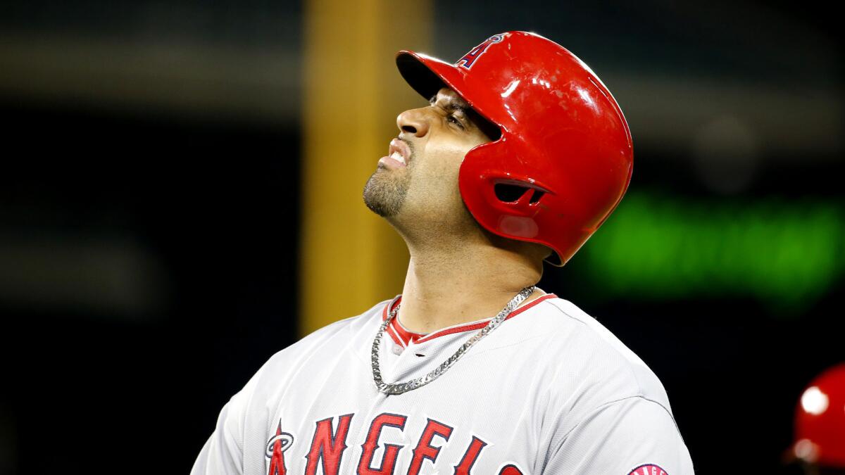 Angels slugger Albert Pujols reacts after grounding out recently, sore foot and all.