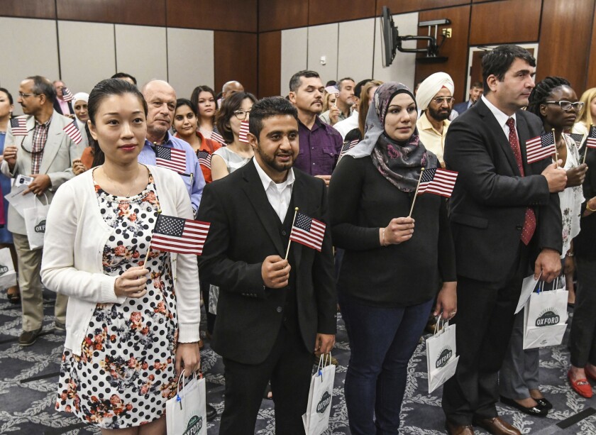 Fifty people from more than 20 countries took the oath of citizenship in Oxford, Miss. 