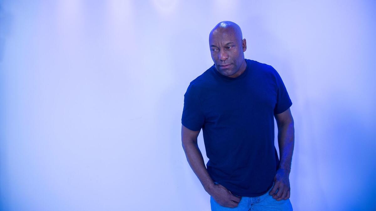 John Singleton, now 49, looks back at the verdict that stunned Los Angeles and sparked upheaval across the city with “L.A. Burning: The Riots 25 Years Later,” which airs Tuesday on A&E.