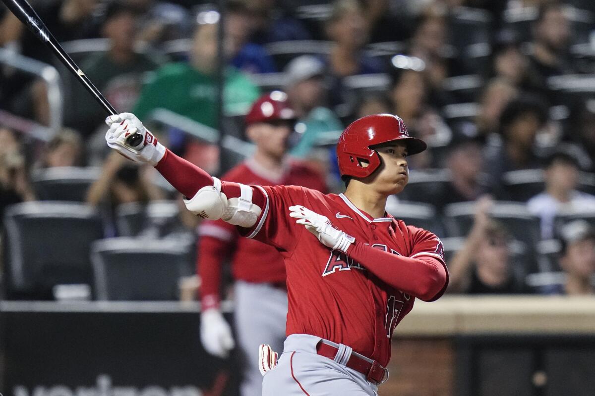 Angels' Shohei Ohtani follows through on a double during the third inning against the New York Mets.