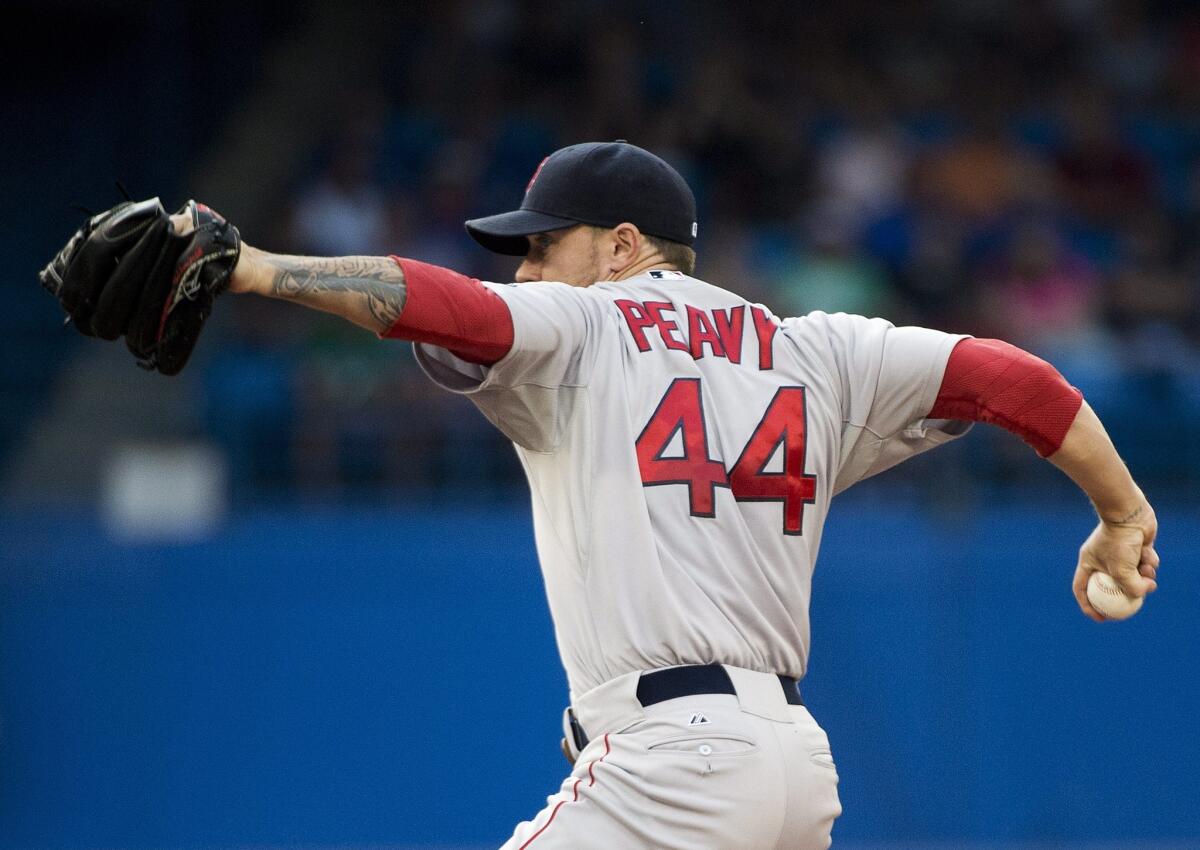Jake Peavy pitches for Boston against Toronto on Tuesday.